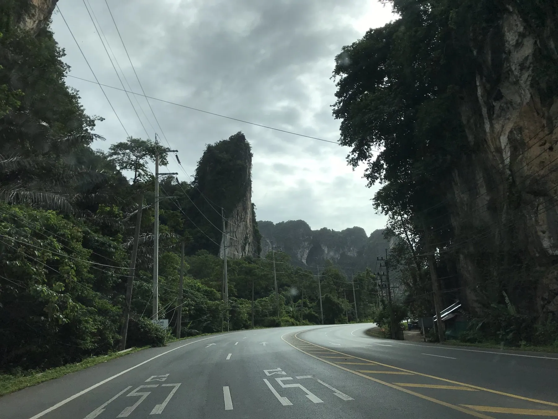 Route 4034 between Ao Nang and Krabi town, the road running below sudden limestone cliffs