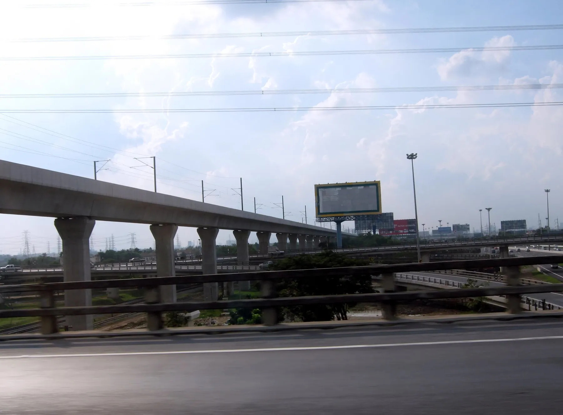 The elevated airport rail link running alongside the outer ring road east of Bangkok