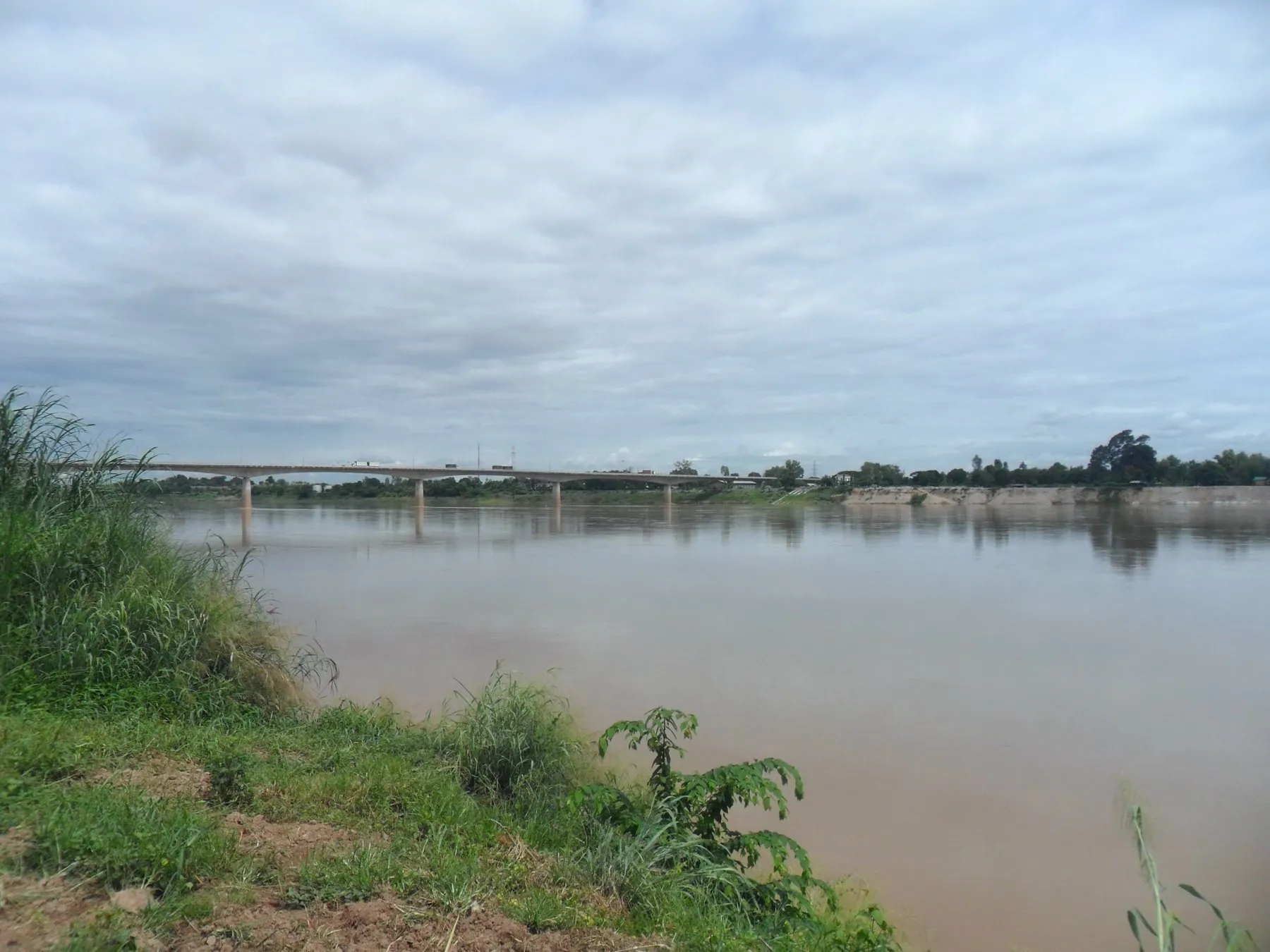 The First Thai-Lao Friendship Bridge carrying the road across the brown Mekong at Nong Khai