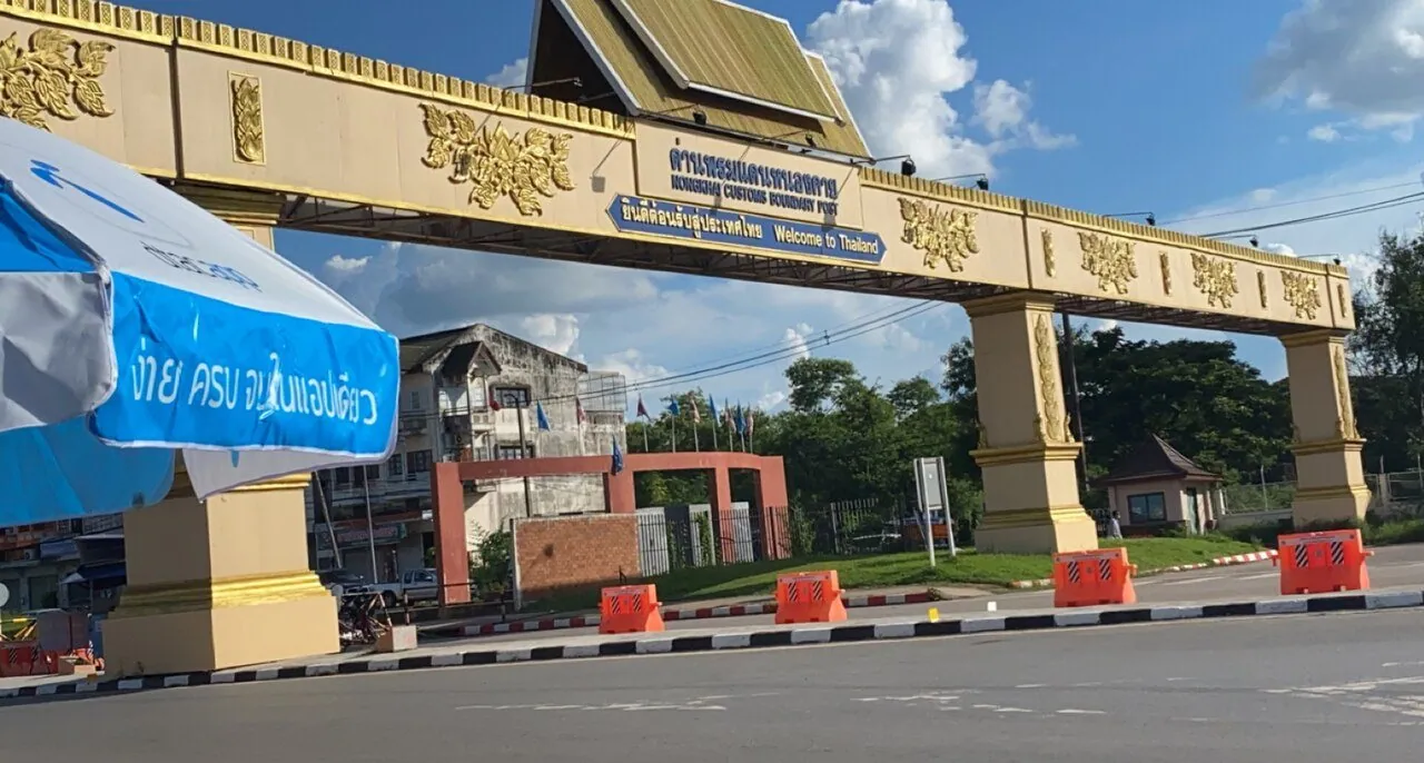 The Thai side of the Nong Khai land border checkpoint, a gilded gateway spanning the road to Laos