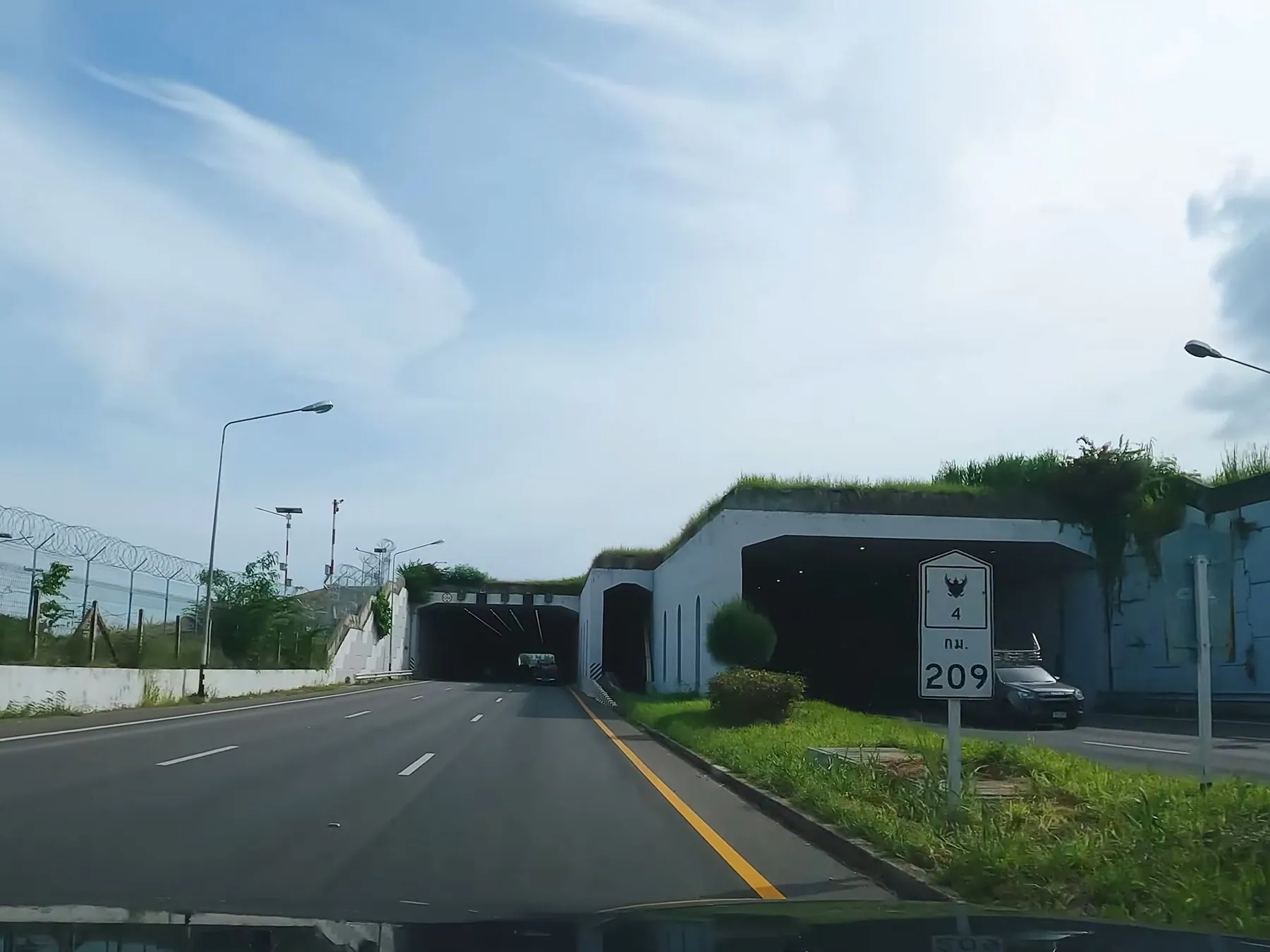 The road tunnel under the runway approach at Hua Hin airport, seen from a car on Highway 4