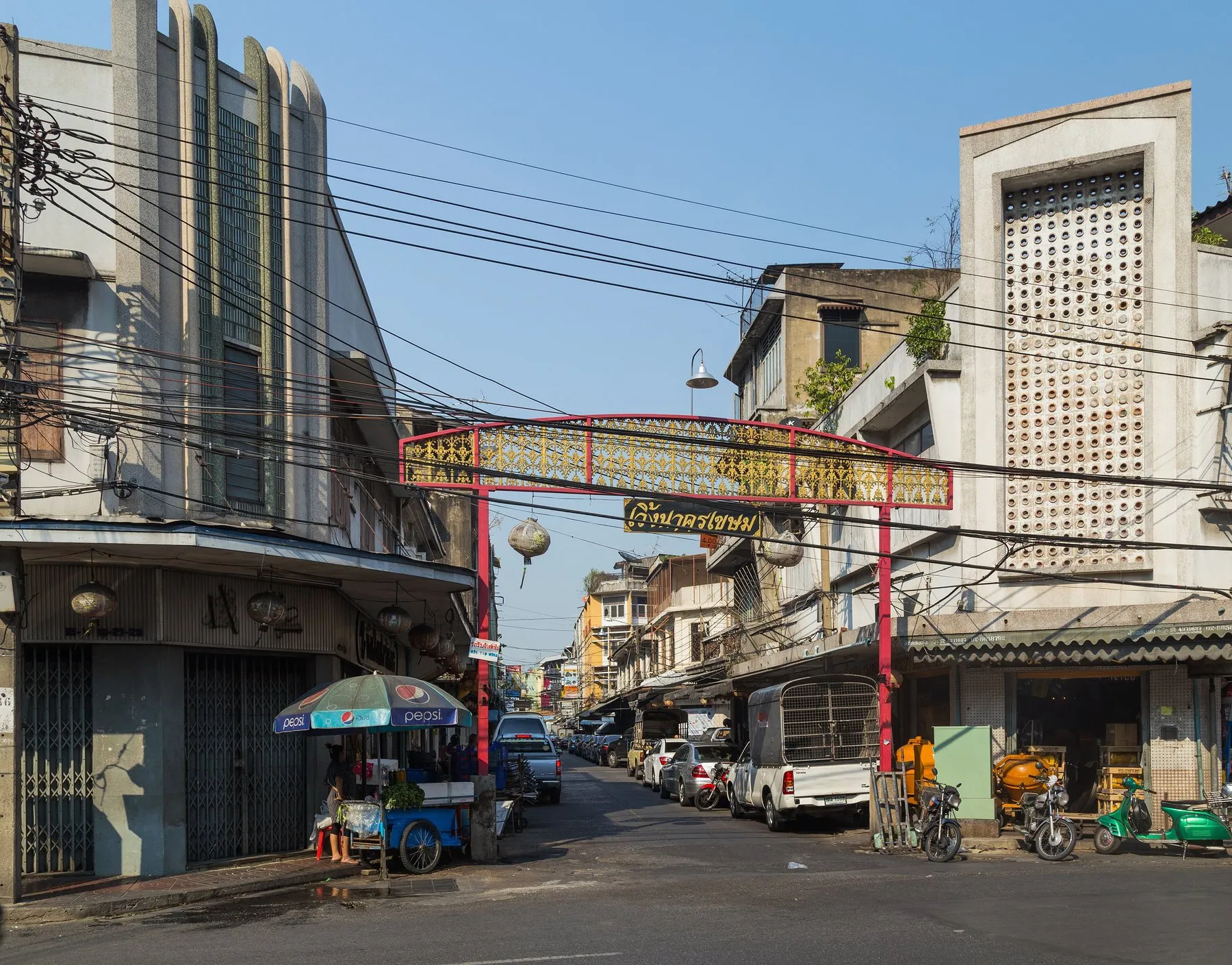 The narrow mouth of Charoen Krung Soi 10 in Bangkok's Samphanthawong district, shophouses either side