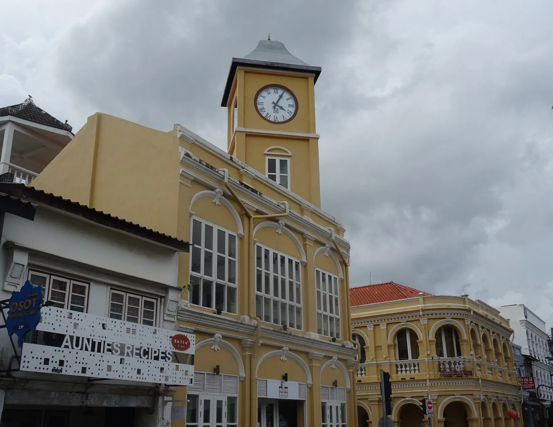 The front of Phuket municipality police station with its Thai-script name board over the entrance