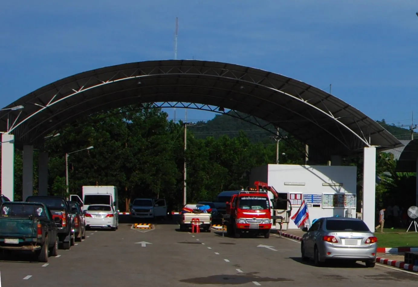 Cars queuing to pass through a roadside vehicle inspection point in Chumphon province