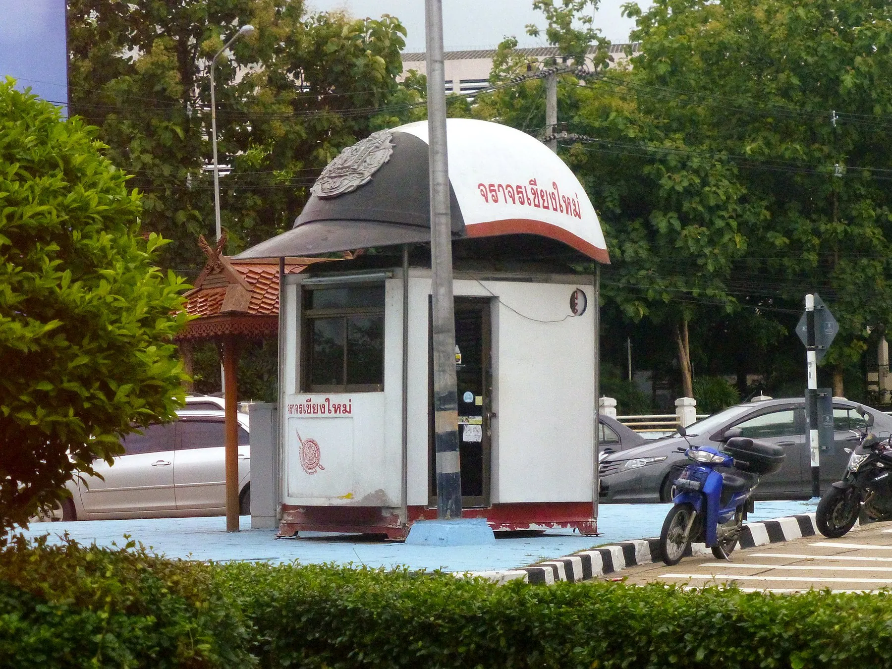 A small Thai roadside police box built with a giant police helmet for a roof