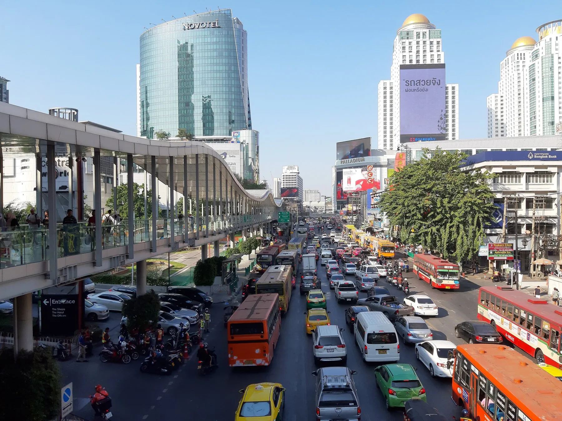 Ratchadamri Road in Bangkok seen from above, several lanes of cars, buses and motorbikes at a standstill