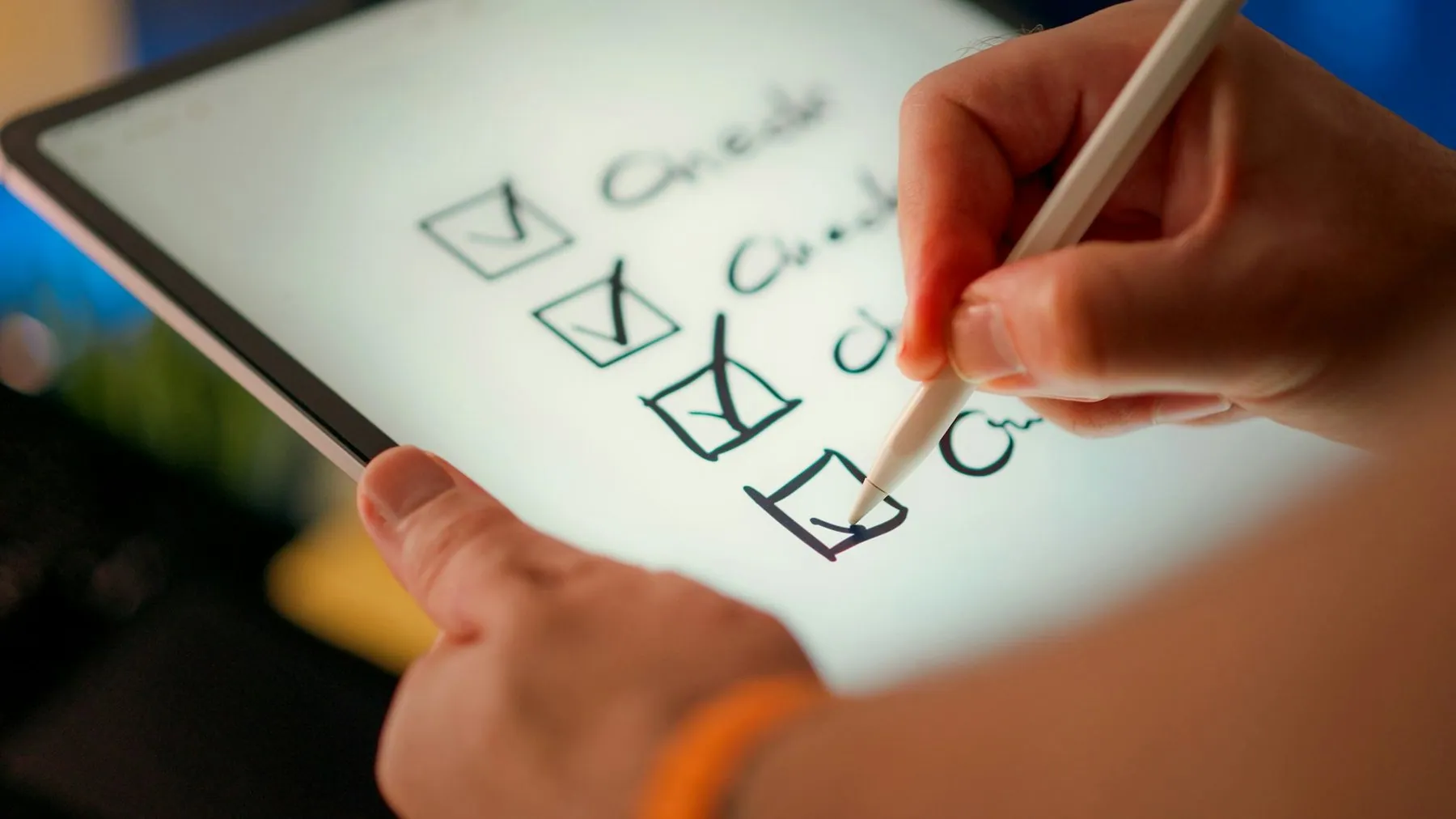 A hand marking ticks down a column of hand-drawn checkboxes, one after another